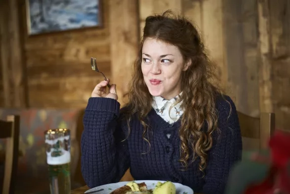 Happy woman eating out in a restaurant Happy woman eating out in a restaurant